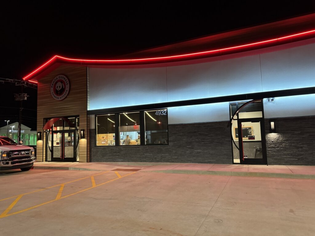 Completed Panda Express storefront and commercial entrances at night